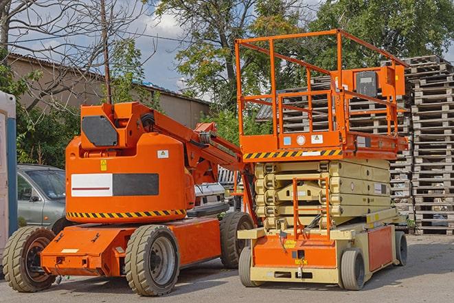 forklift handling inventory in a crowded warehouse environment in Etna